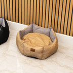 Sand-coloured pet bed with grey interior, shown from above