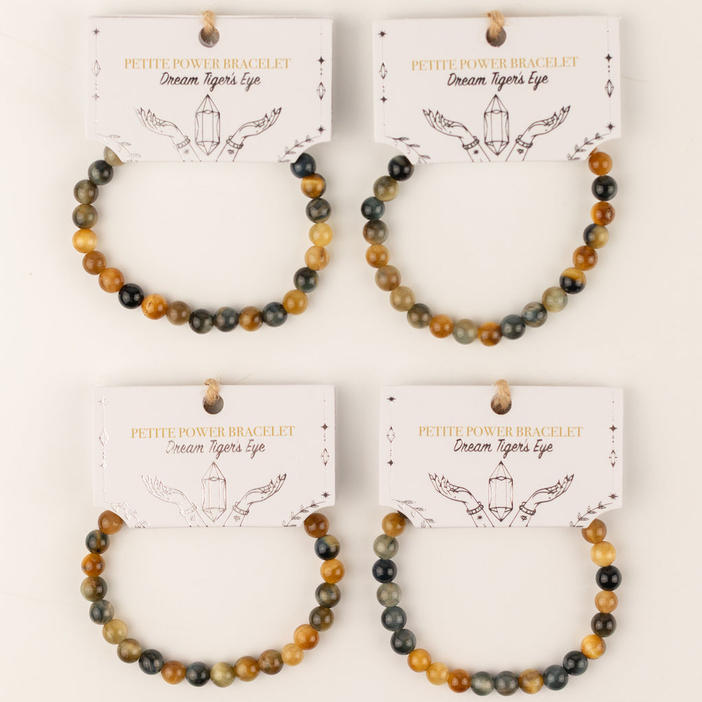 Four Dream Tigereye bracelets on illustrated cards