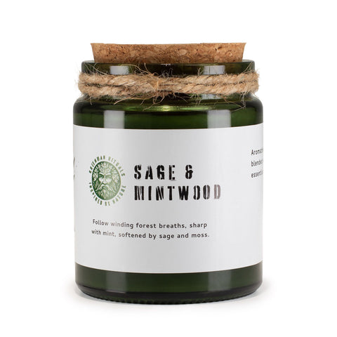 Sage & Mintwood candle in a green glass jar, close-up of the front label and cork lid