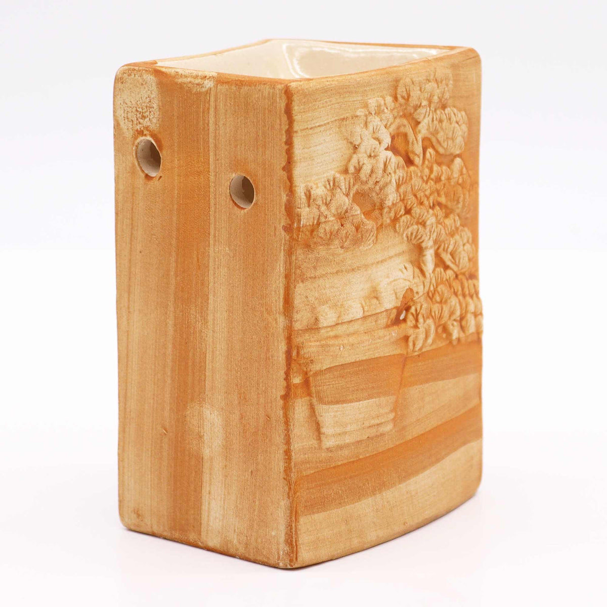 Hand Painted Bonsai Burner, Sand, angled view showing the raised bonsai design and two side holes