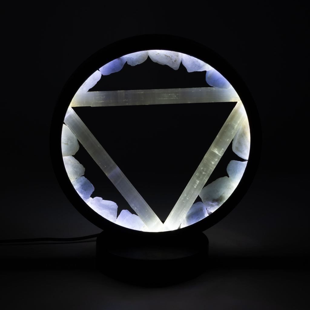 Illuminated halo lamp against a dark background