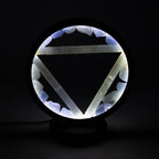 Illuminated halo lamp against a dark background