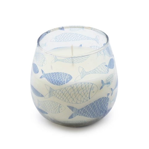 Seabreeze candle in a clear glass jar with blue fish, shown close up on white
