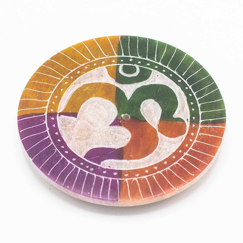 Om soapstone incense holder disc shown from above on a white background, with a multicoloured design