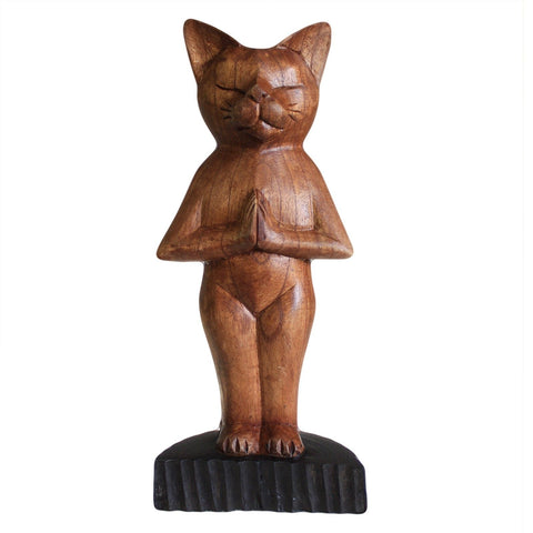 Standing yoga cat carved figure with dark base, shown alone against a white background