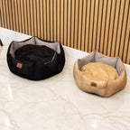 Black and grey pet bed beside a tan version
