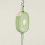 Close view of green Pocket Pod casing and button