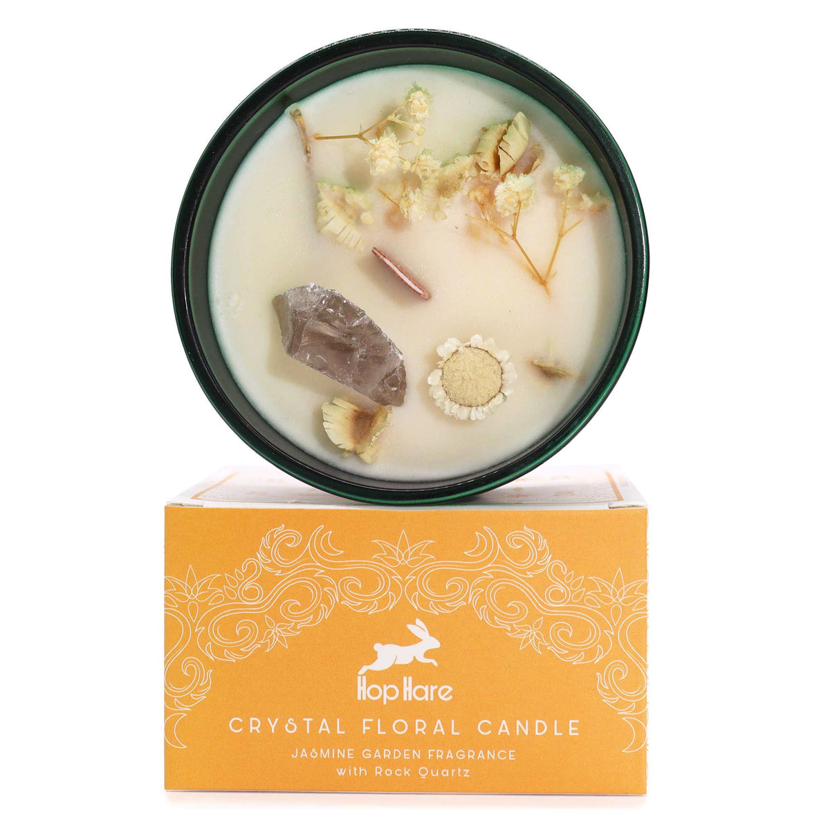 Hop Hare Lion crystal candle open, rock quartz and dry flowers in the wax, on its orange box