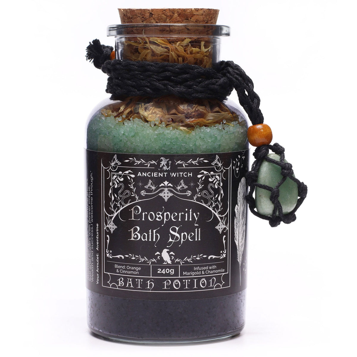 Ancient Witch bath potion bottle with green amulet hanging beside it