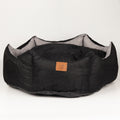 Black crown-shaped pet bed viewed from the front