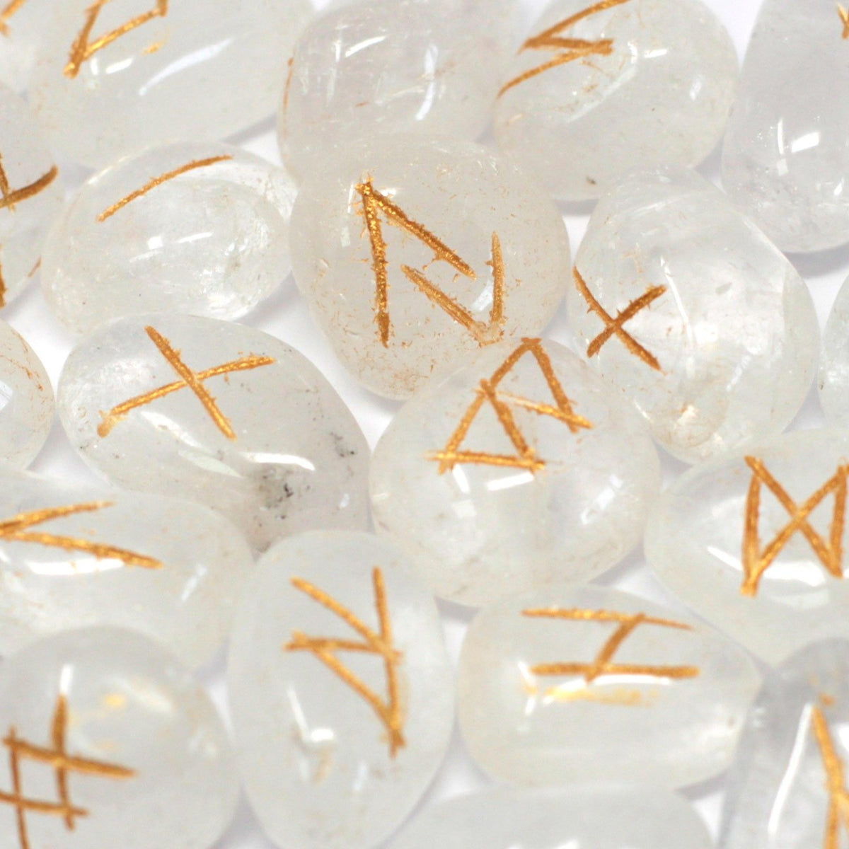 Runes Stone Set in Pouch, Crystal, close-up of clear stones with gold-coloured rune markings
