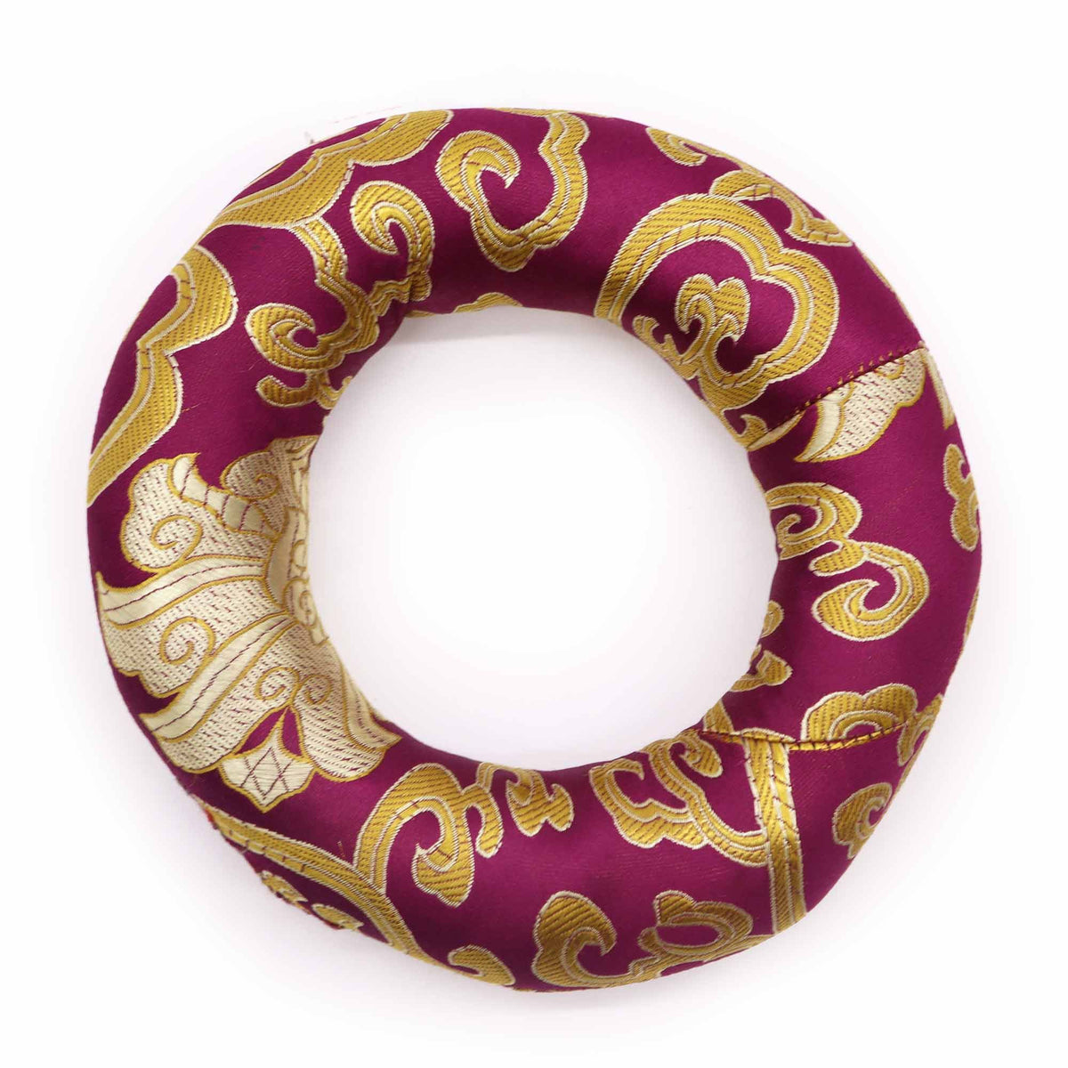 Hoop Cushion, round burgundy fabric cushion with gold patterns, shown from above on a plain background