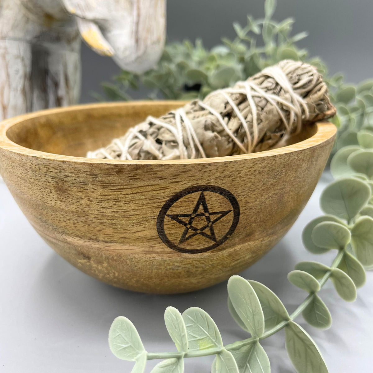 Wooden Smudge and Ritual Offerings Bowl, Pentagram, close-up of the brown bowl with a smudge bundle