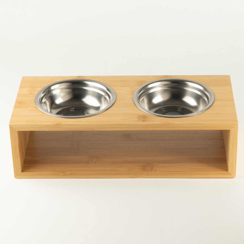 Two bowls fitted side by side in the wooden stand