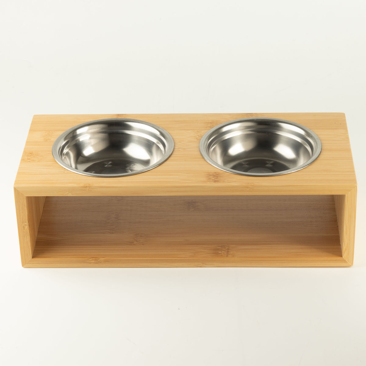 Two bowls fitted side by side in the wooden stand