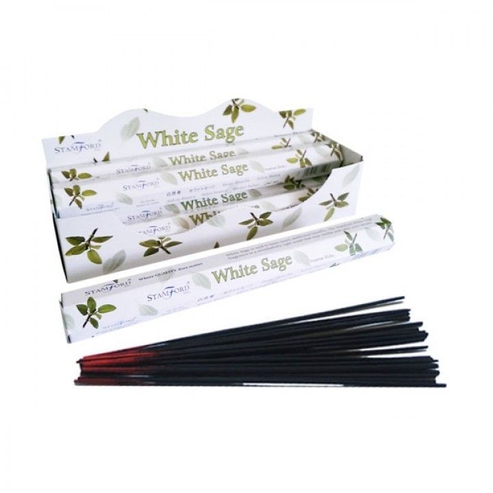 White Sage Premium Incense in open white boxes with green leaf designs, loose dark sticks arranged in front