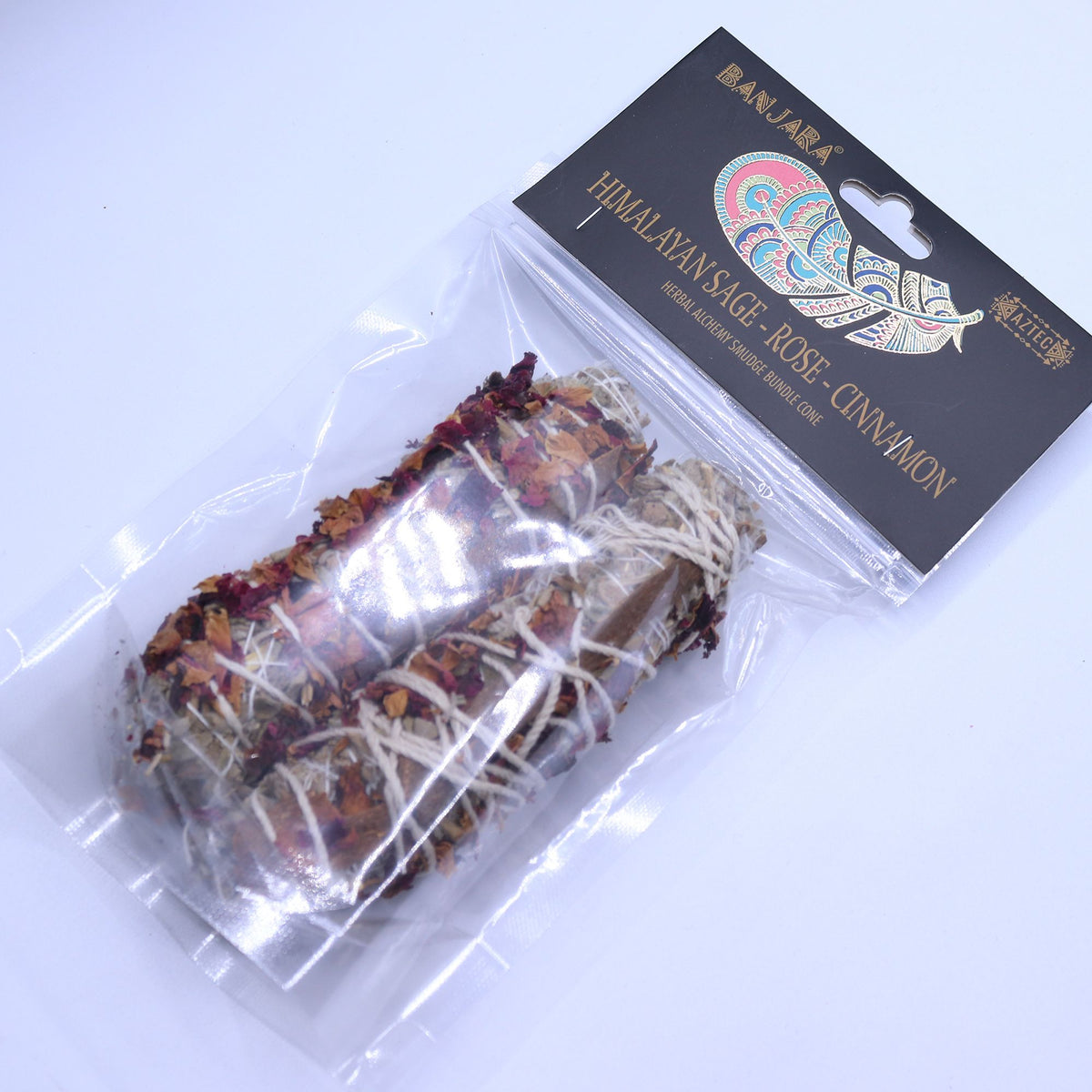 Banjara Smudge, Himalayan Sage, Rose, Cinnamon in a clear bag with a black header, shown at an angle