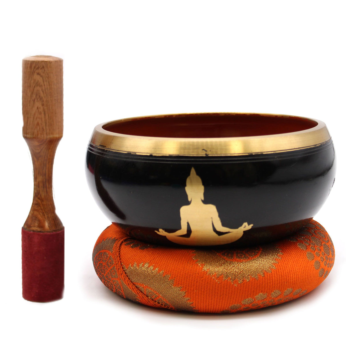 Buddha singing bowl and orange patterned cushion beside a wooden striker, front view on white