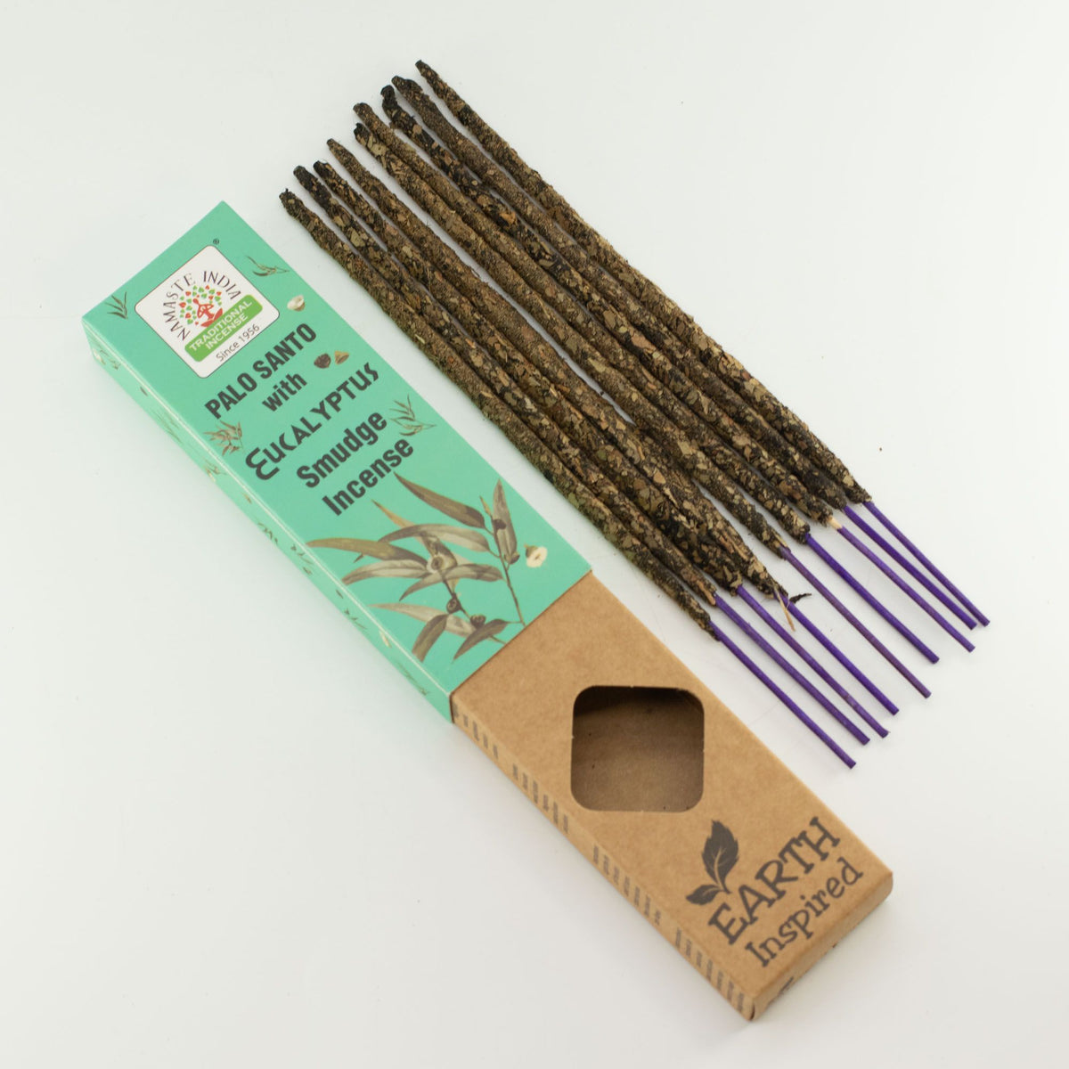 Loose Eucalyptus smudge incense sticks laid out beside their retail box