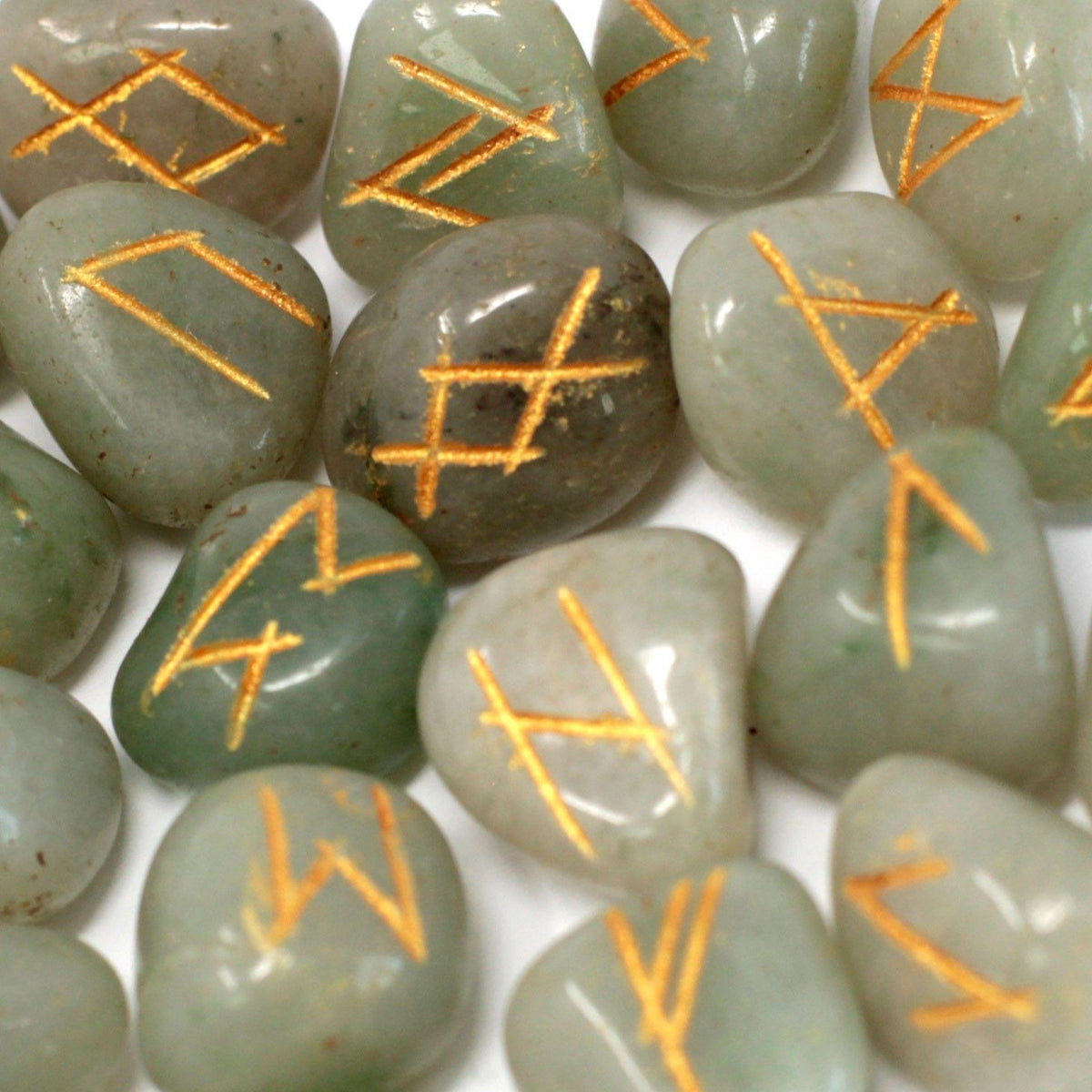 Runes Stone Set in Pouch, Green Aventurine, close-up of green stones with gold rune markings