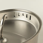 Close-up of slots around the fountain's inner rim