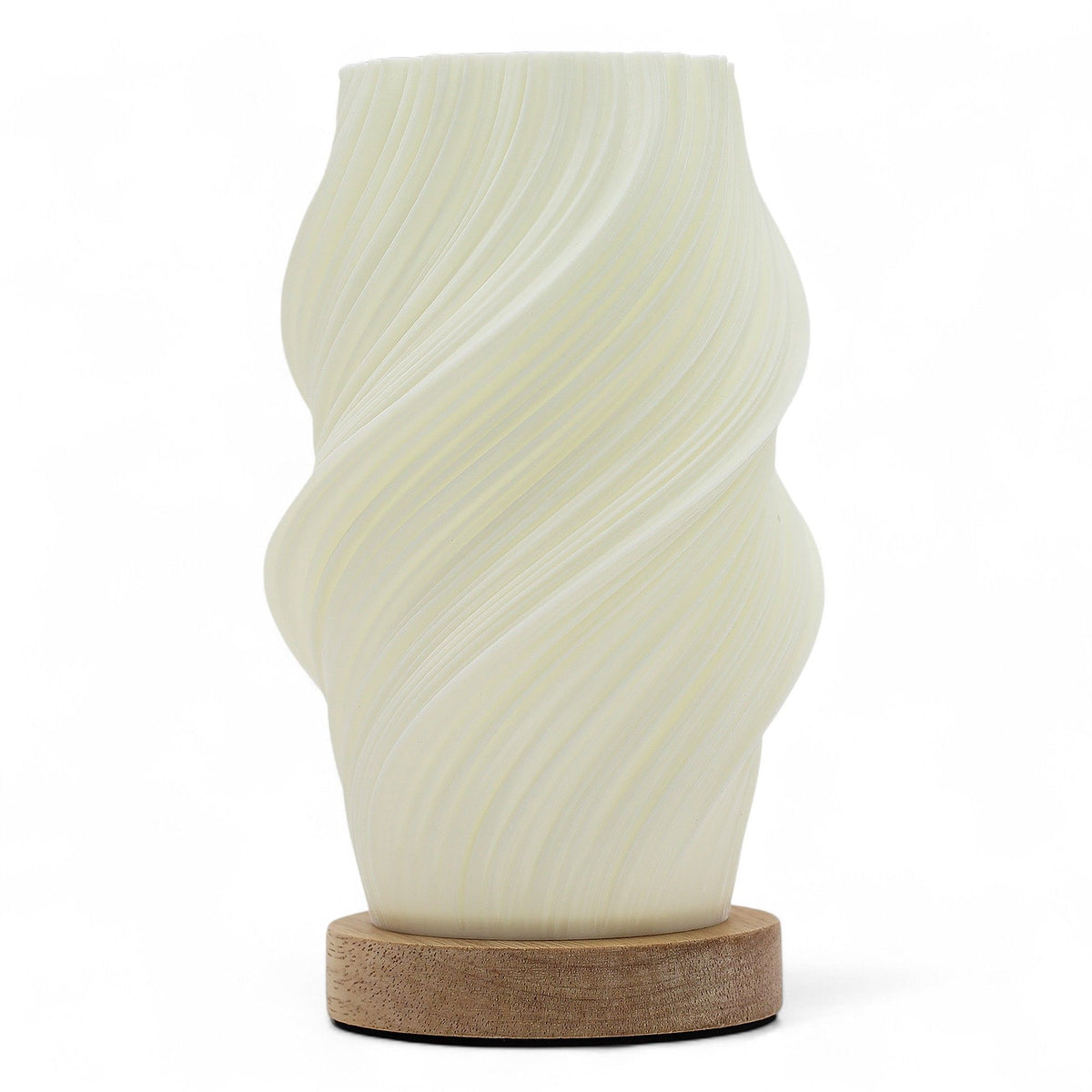Cloud Twisted lamp unlit, showing its pale ribbed shade and round wooden base against white