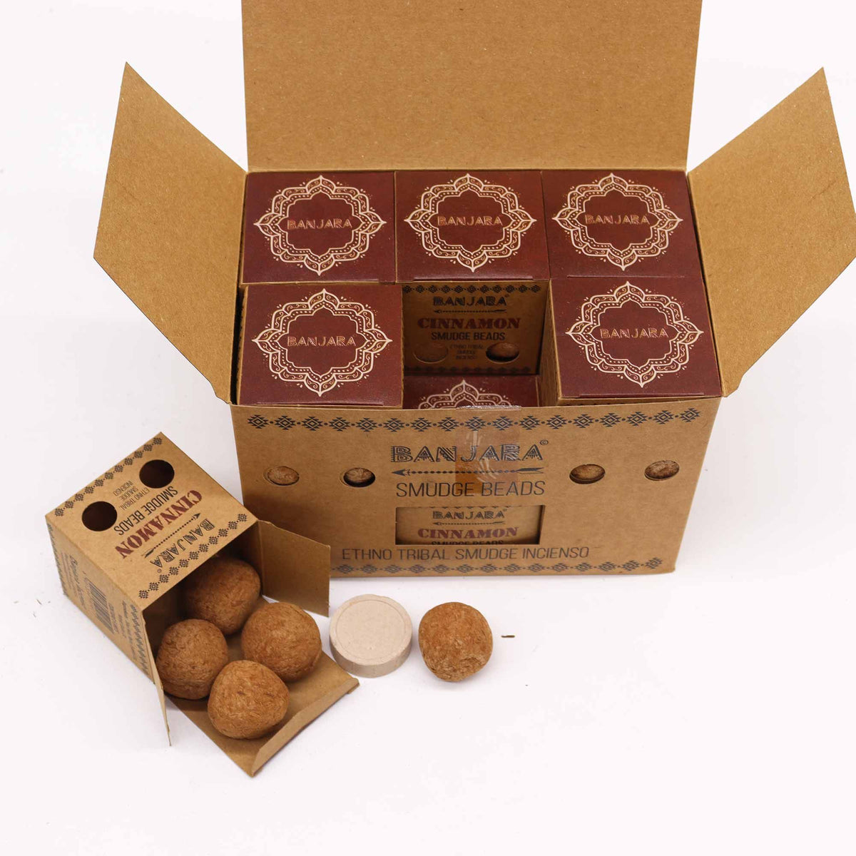 Banjara Smudge Beads, Cinnamon in an open display box, with an open carton and loose brown beads