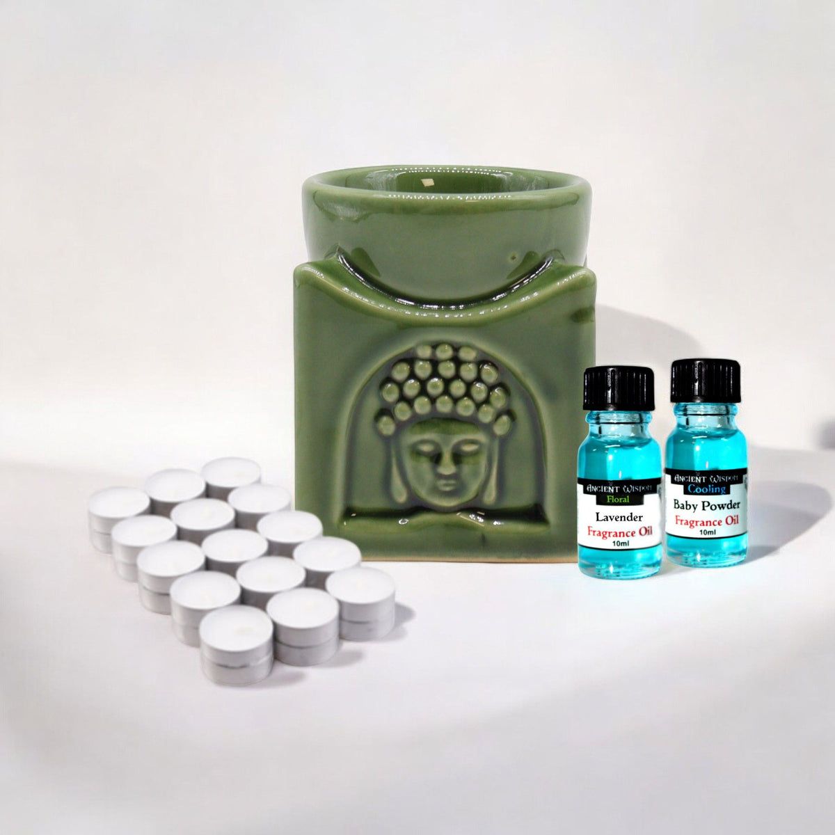 Oil Burner, Fragrance Oils & Tealights Kit with a green Buddha burner, two blue oil bottles and tealights