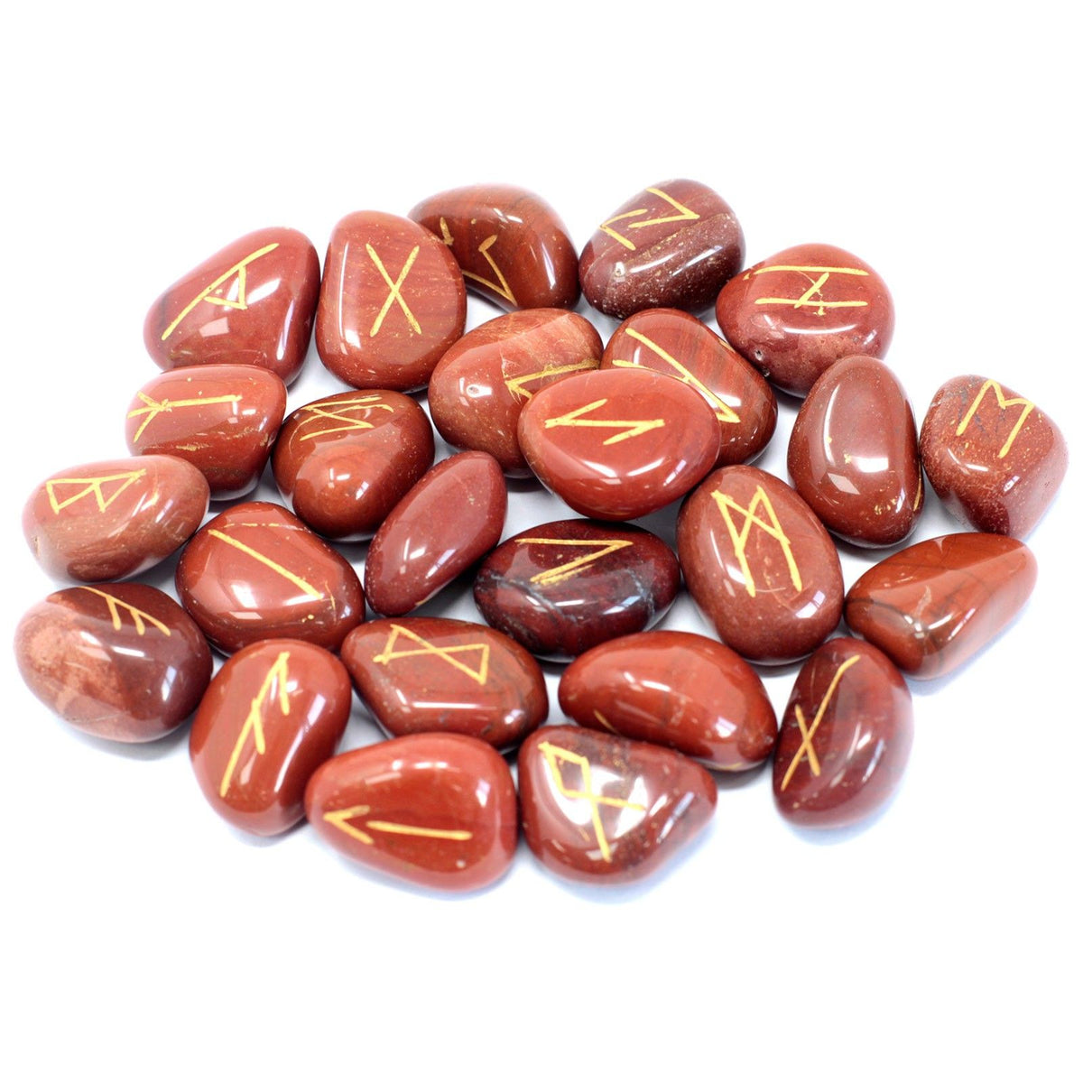 Red jasper rune stones arranged together on a white background, showing their gold markings
