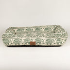 Front view of the green elephant-patterned bed