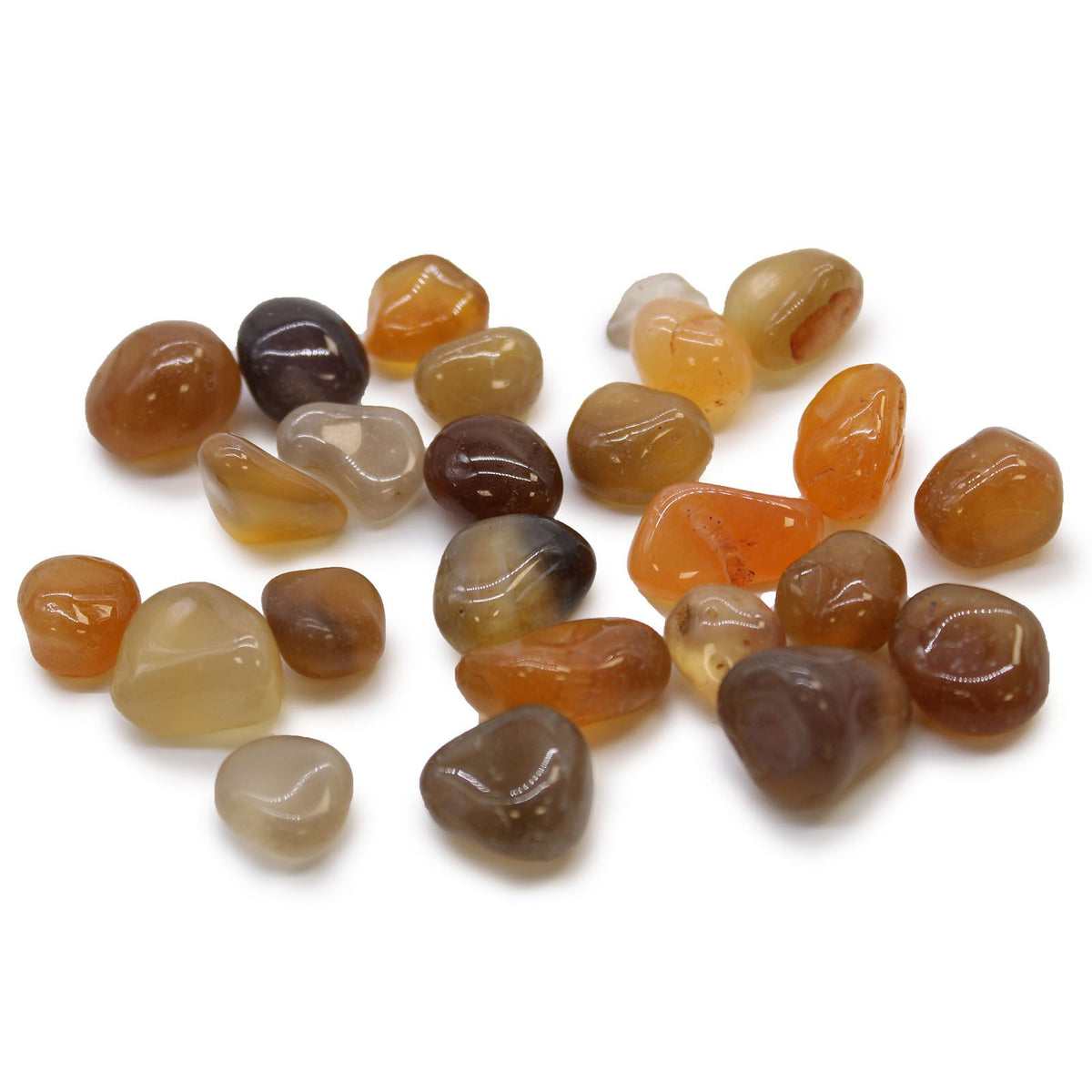Small African Tumble Stones in mixed amber, orange, brown and pale yellow tones, scattered on white