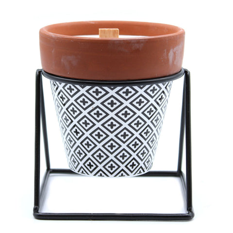 Agnes + Cat Herb Garden Candle, Lavender in a patterned ceramic pot on a black metal stand