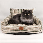 PAW striped sofa pet bed with a cat on the seat