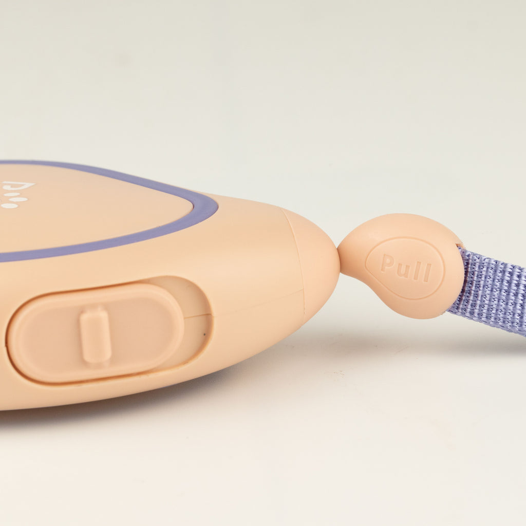 Close-up of the lead's button control and wrist strap