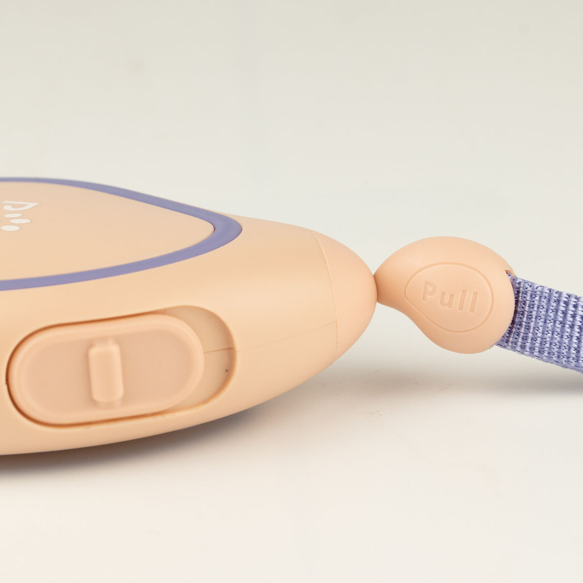 Close-up of the lead's button control and wrist strap
