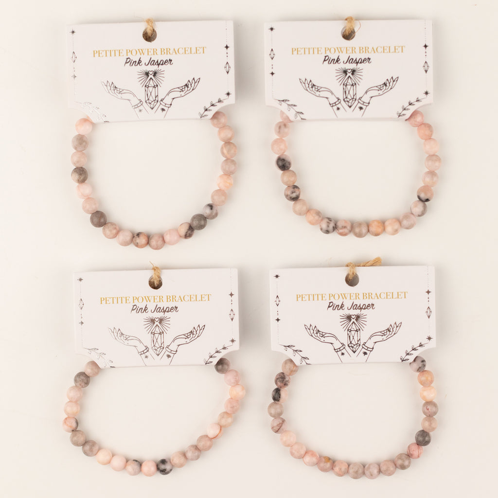 Four Pink Jasper bracelets on illustrated cards
