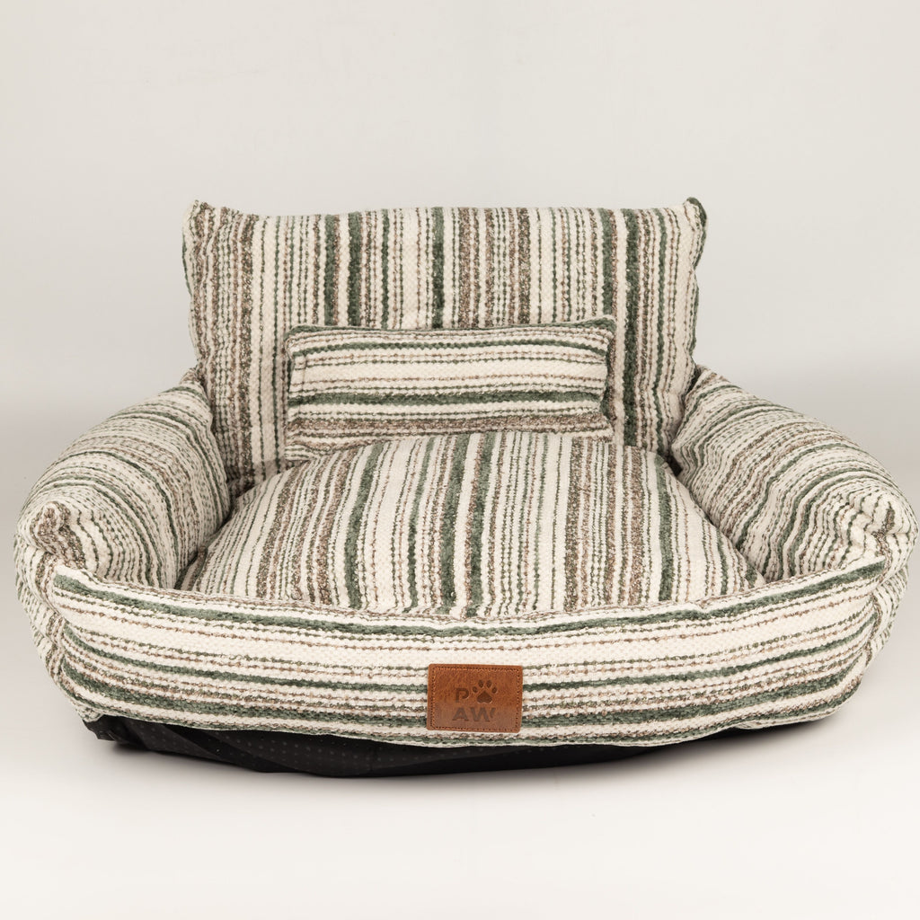 PAW pet sofa bed shown with the striped side of the seat cushion