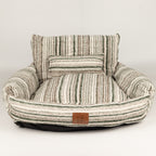 PAW pet sofa bed shown with the striped side of the seat cushion