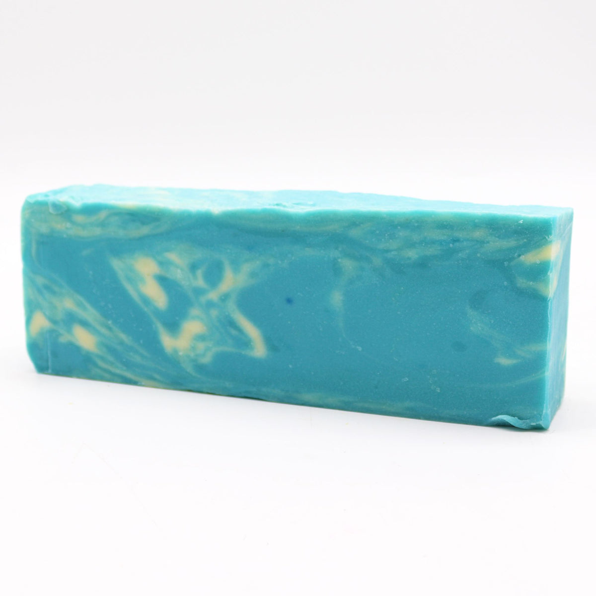 Seaweed, Olive Oil Soap Loaf, long turquoise bar with pale swirls, shown from the front