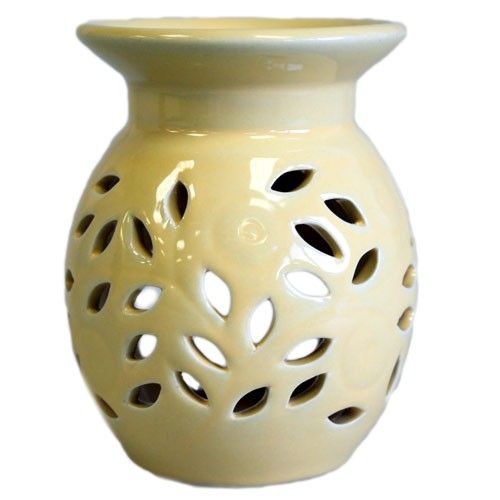 Floral Oil Burner -Yellow, glossy pale yellow burner with leaf-shaped cut-outs, shown from the front
