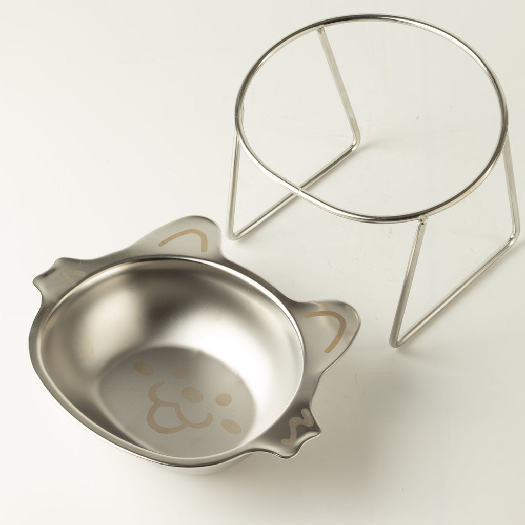 Removable cat bowl shown beside its raised metal stand
