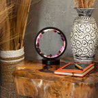 Lit amethyst halo lamp displayed on a wooden table