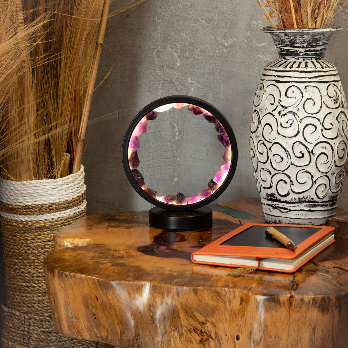 Lit amethyst halo lamp displayed on a wooden table