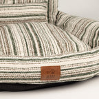Detail of the brown seat cushion and striped front edge