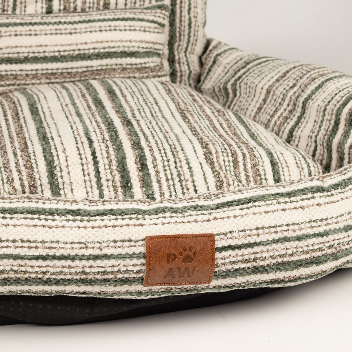 Detail of the brown seat cushion and striped front edge