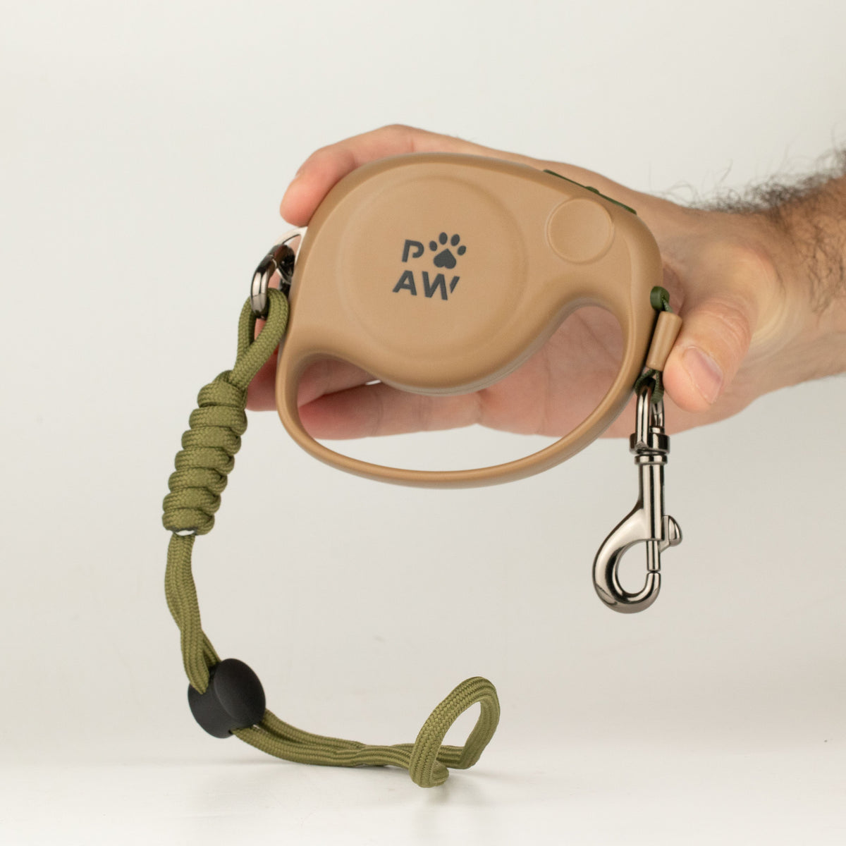 Hand holding the lead casing, clip and rope wrist strap