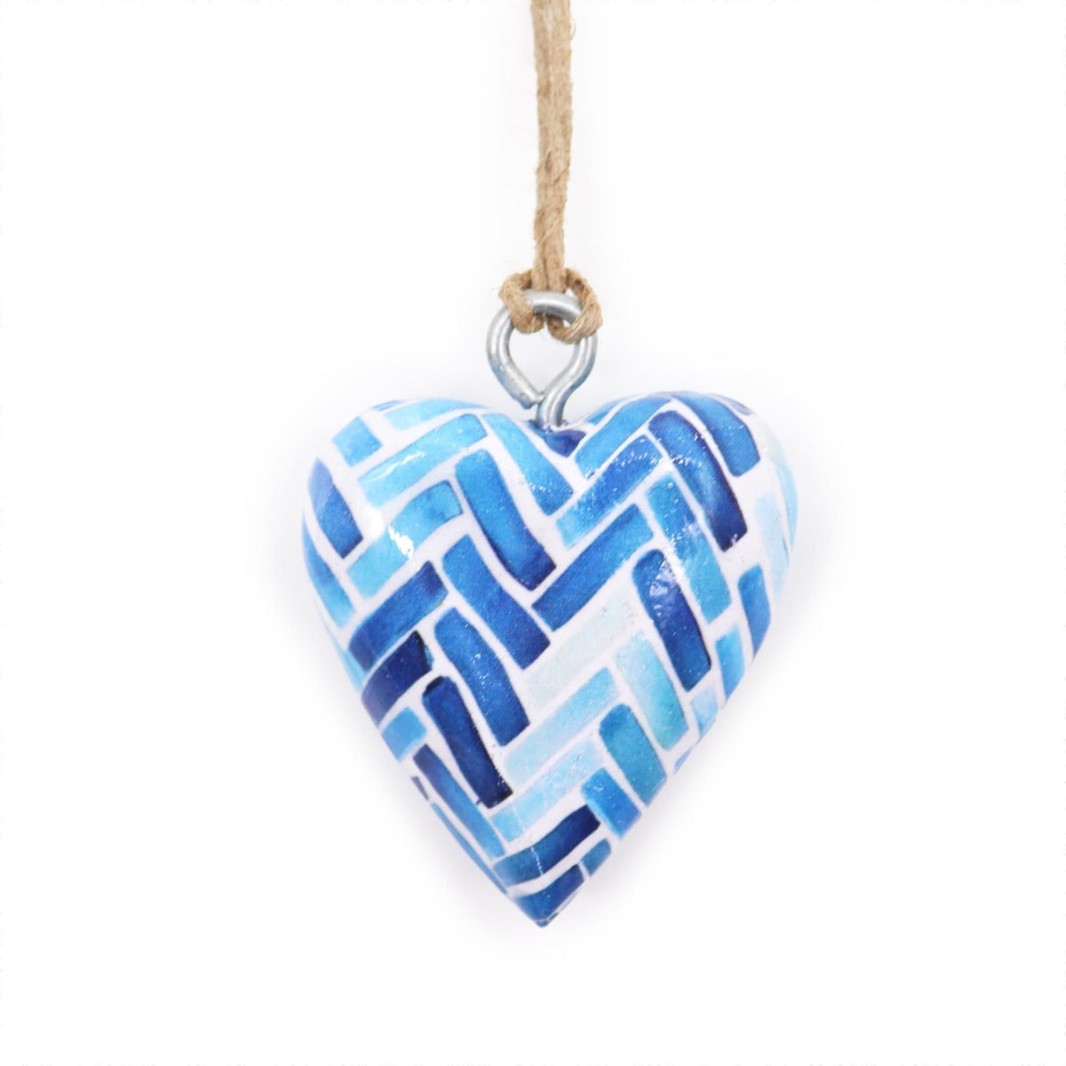Blue striped wood heart hanging from its cord, shown close up against a white background