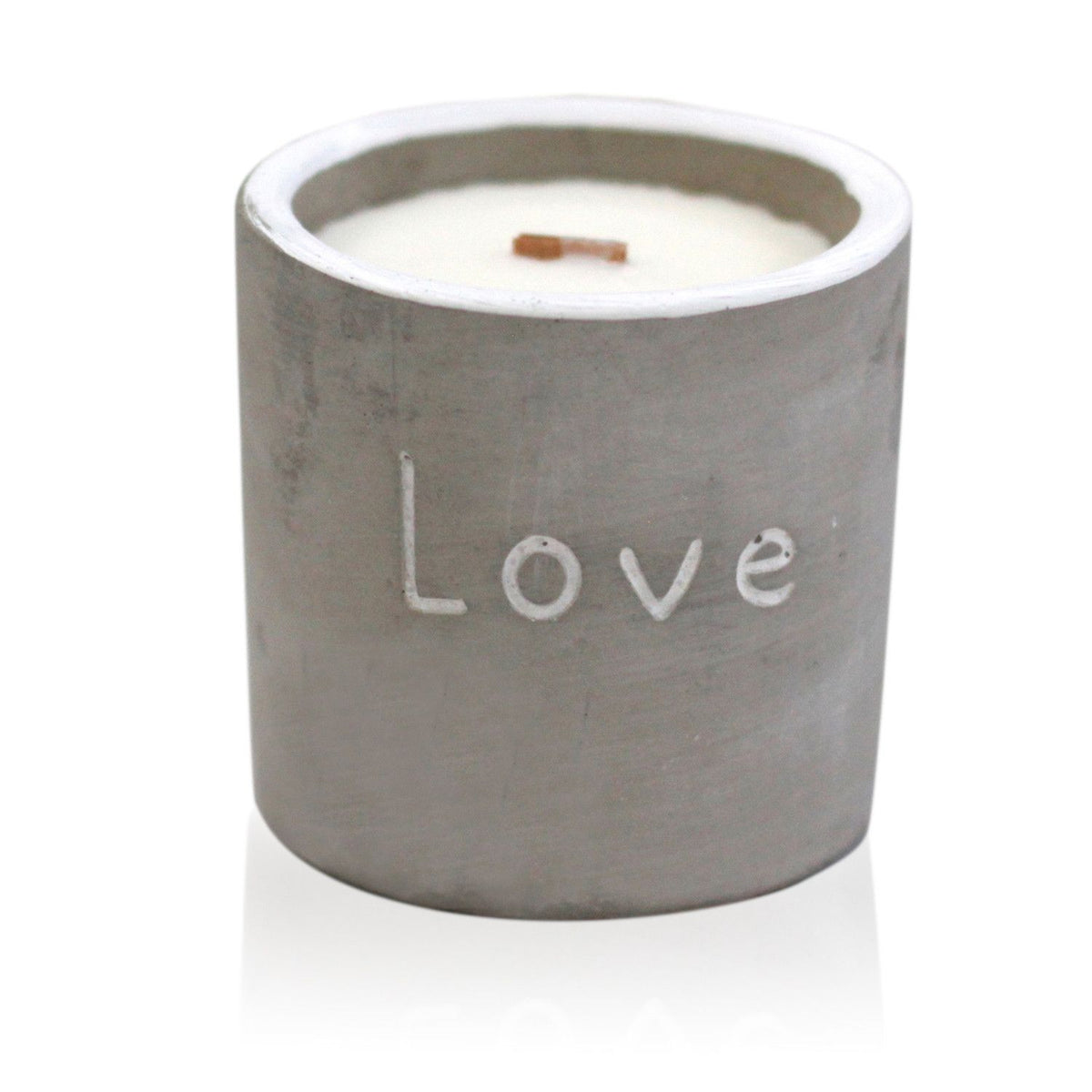 Med Pot, Love, Purple Fig & Casis candle in a grey pot, unlit with its wooden wick visible