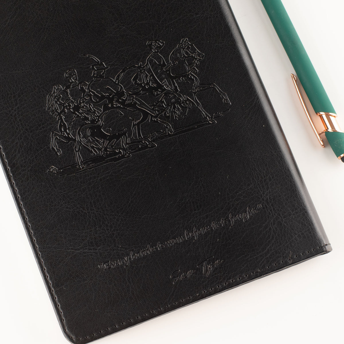 Embossed black leather-effect notebook cover with stitched edge