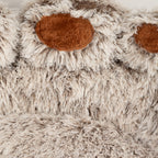 Close-up of a brown pad against the shaggy plush